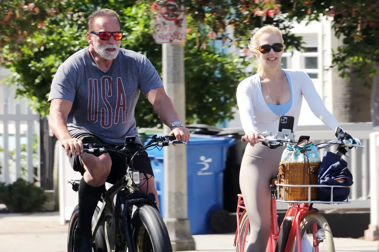 Couple Heather Milligan and Arnold Schwarzenegger After your workout, take a bike ride together 
